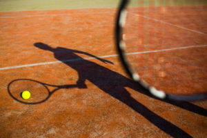 tennis player shadow with ball