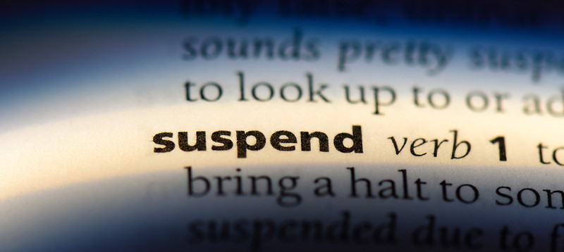 suspend word in dictionary close up