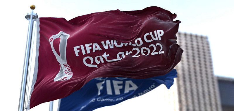 qatar world cup and fifa flags in the wind